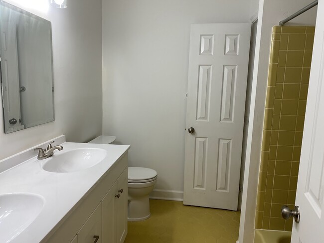 upstairs full hall bath with closet - 3705 Pfost Ave