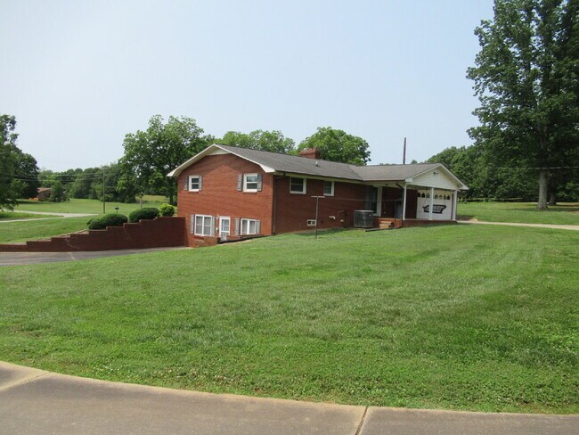 Building Photo - Charming All-Brick Ranch with Finished Bas...