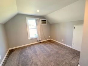 Building Photo - This spacious four-bedroom, two-bathroom
