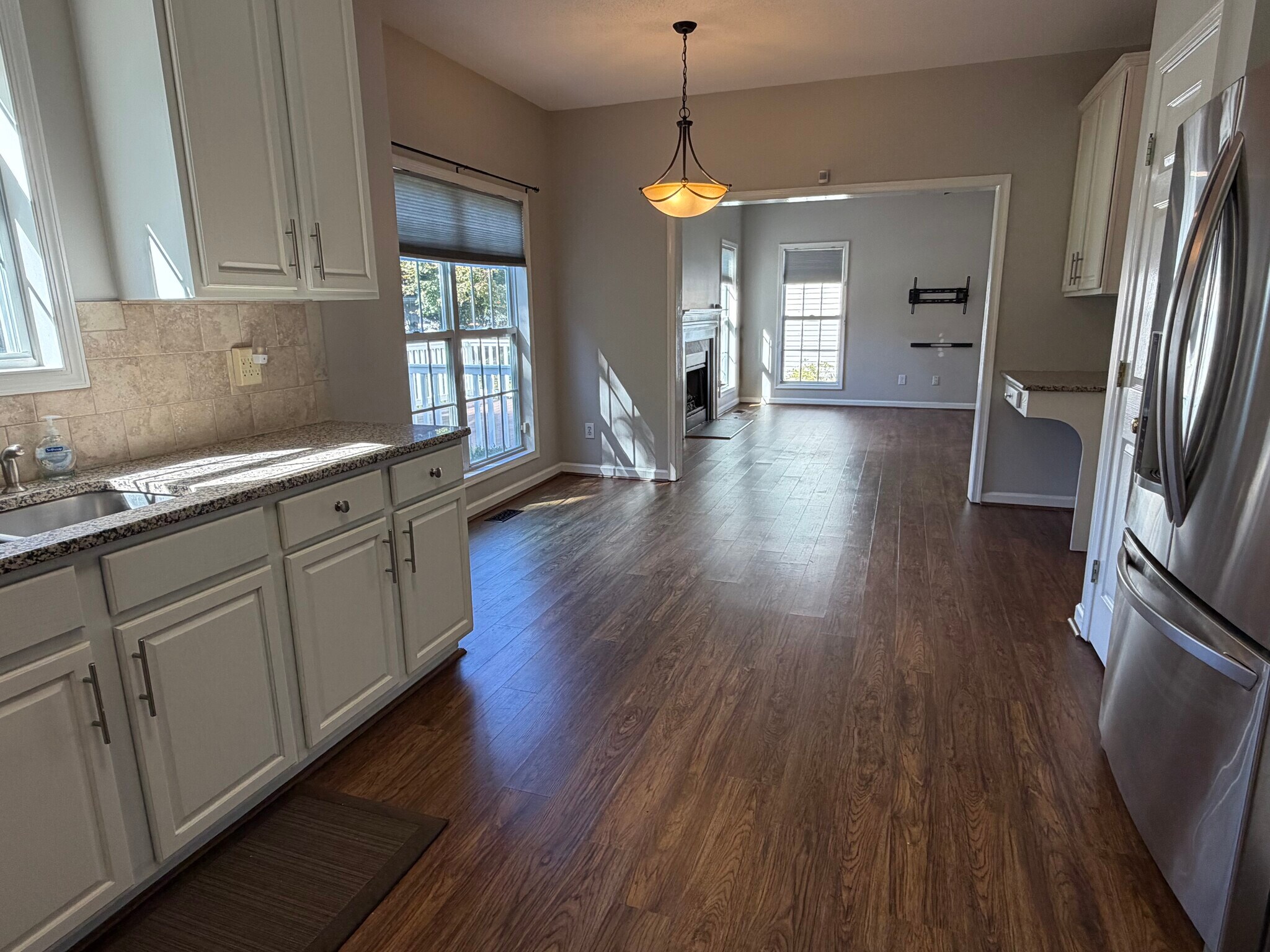 This view of the kitchen shows the open floor plan to the Den - 6419 Woodmont Rd