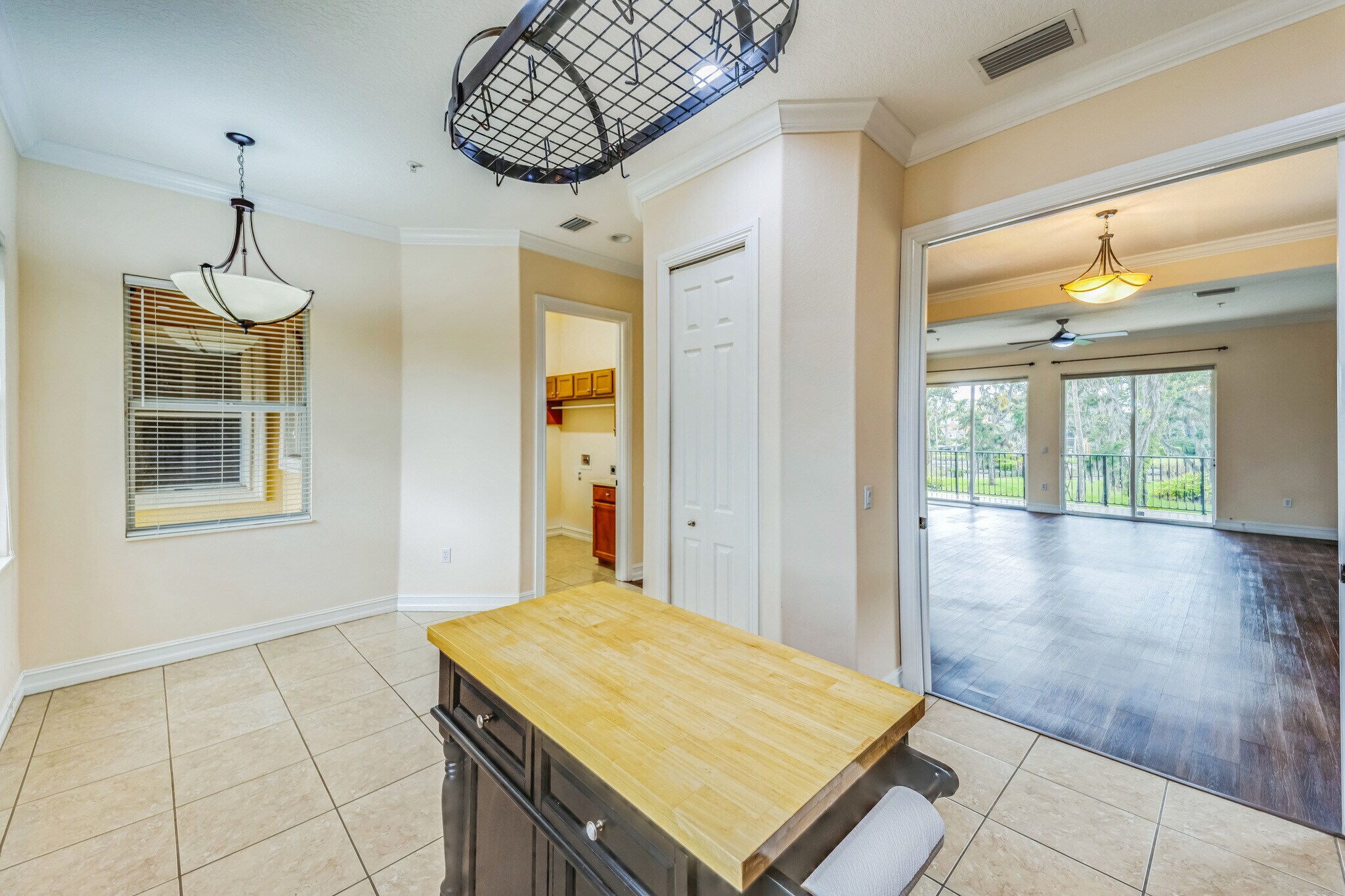 pantry and laundry in the background. Pocket doors to the living room - 1408 3rd Street Cir E