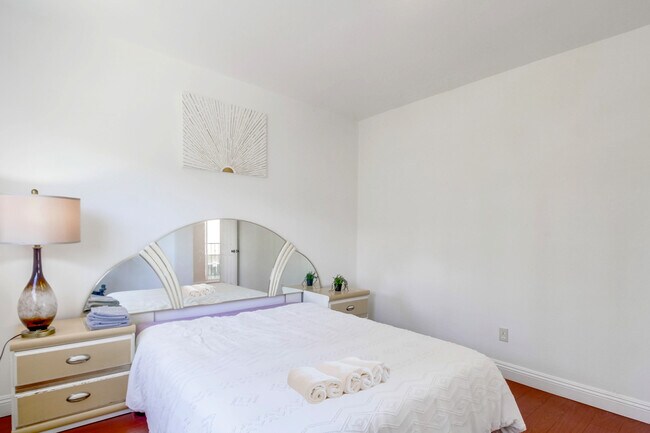 Each bed comes topped in soft and fresh sheets. - 2304 E 14th St