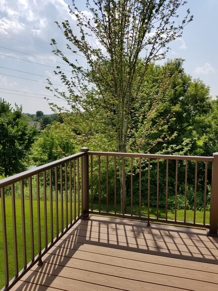 Deck overlooking pond and trees - 9719 Xenium Lane N