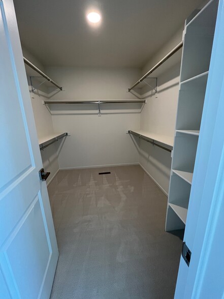 Walk-in closet primary bedroom - 5030 McKinnon Ct