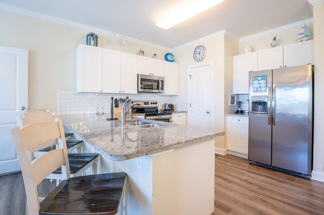 Building Photo - PRICE REDUCTION! LIVE AT THE BEACH FOR THE...