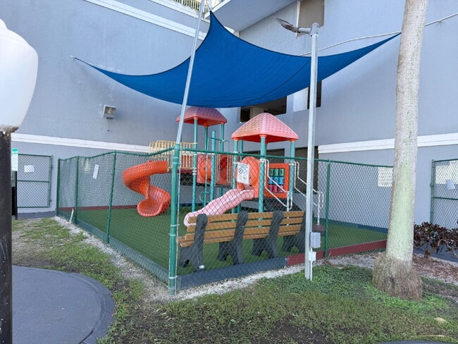 Building Photo - Rare 2/2 Corner Penthouse with Panoramic Lagoon Views from Every Room – Available Now!