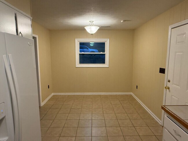 Building Photo - Updated 4BR Home with Finished Basement & Level Yard