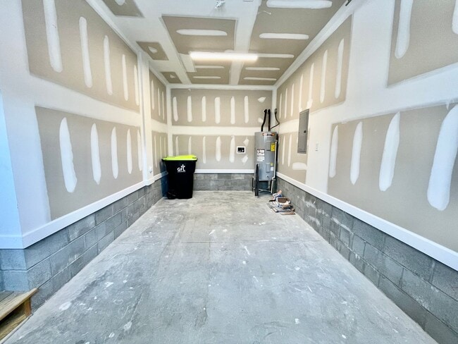 Building Photo - Practically New & Available NOW! Americana Luxury Townhomes! Pet Friendly! Attached Garage! All A...