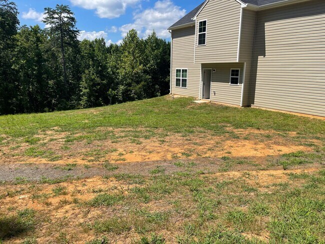 Building Photo - Available Now – Spacious 4BR Home on 1.5 Acres in Rural Hall!