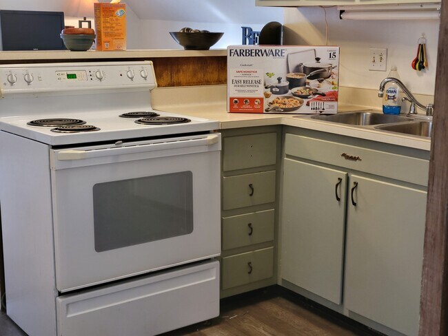 Kitchen stove & lower cabinets - 2215 N 70th St