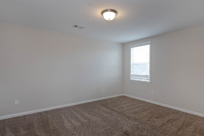 Building Photo - 4BR/3.5BA · 2,809 SF · Owner's Suite on Main · Fenced Yard · Midland, GA — $2,800/mo