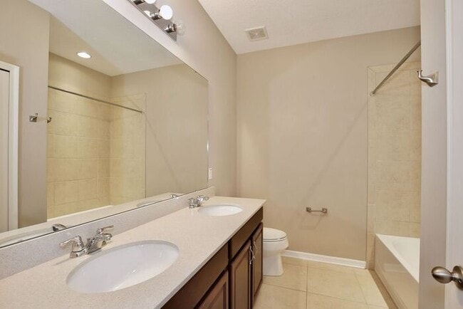 Building Photo - Gorgeous 4/2.5 Spacious Townhome with a Loft Area and a 2 Car Garage in the Desirable Gated Commu...