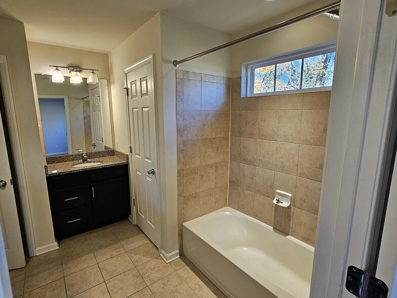 Master Bathroom features a private full bath with dual vanities and a spacious walk-in closet - 1736 Beacon Ln