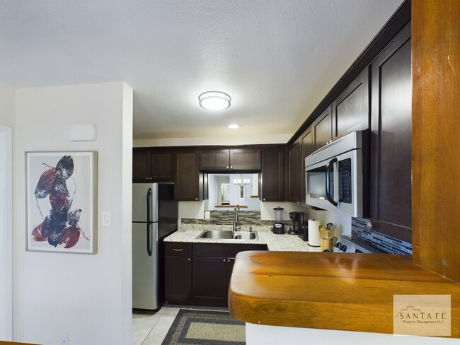 Building Photo - Gorgeous Ground Level Condo at Los Arroyos across from Hospital