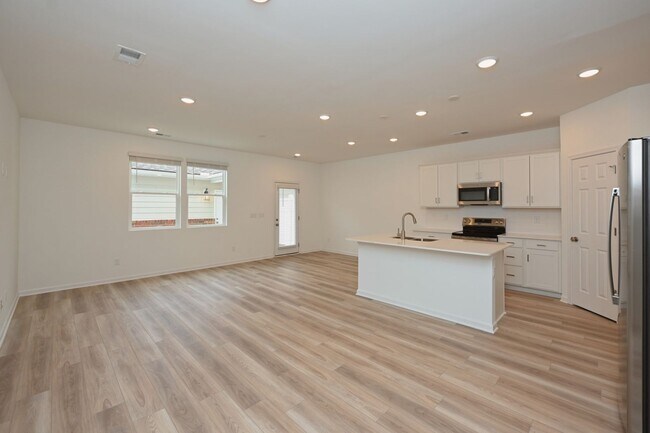 Building Photo - **BE THE LUCKY ONE TO LIVE IN THIS 2024-BUILT BRICK TOWNHOME IN THE VILLAS AT REGAL SQUARE FEATUR...