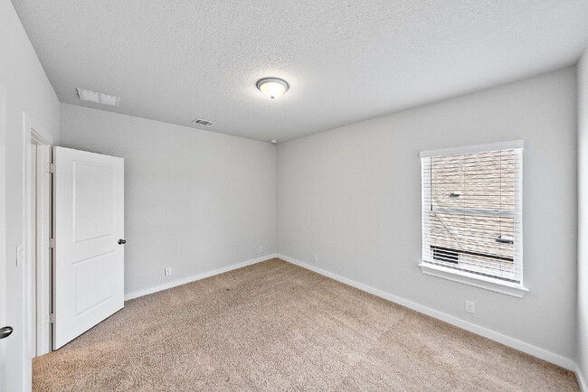 Building Photo - Greenbelt. 3 Car Garage. Built In Dog Room.