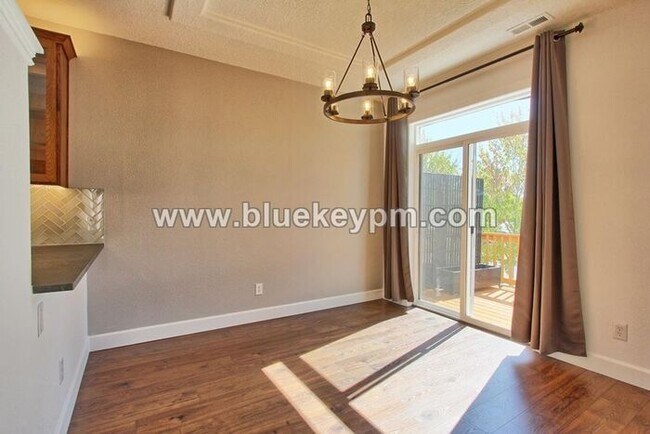 Building Photo - 3 Bed, 3.5 Baths Townhome With Garage Level Suite and Office Space