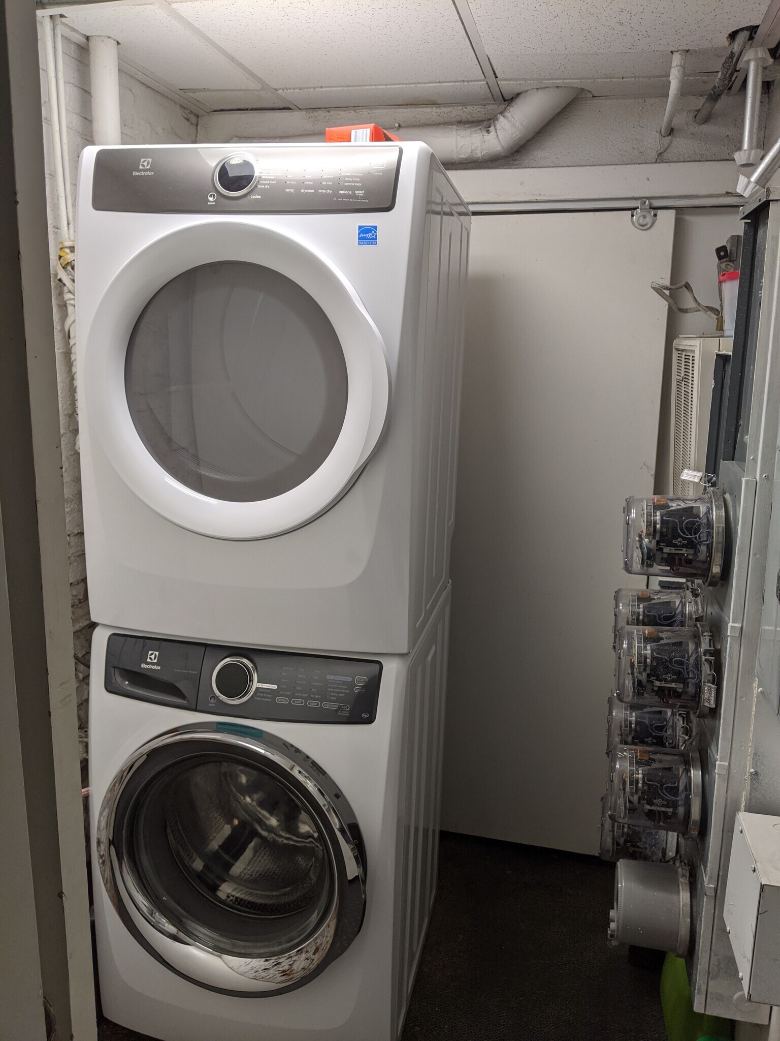 Common free laundry right outside unit front door - 12 Melrose St
