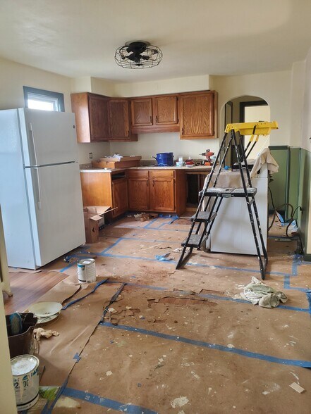 please excuse our mess as we renovate your new kitchen! Fresh paint, refinished cupboards - 321 Odell Ave