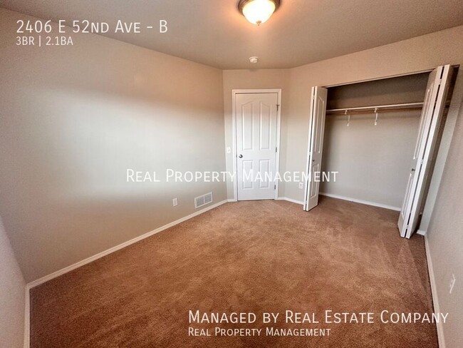 Building Photo - 2406 E 52nd Ave