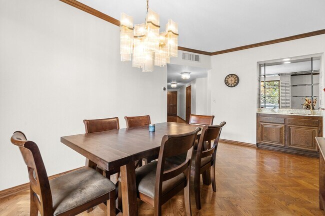 Building Photo - Elegant Corner Condo with Spacious Interiors