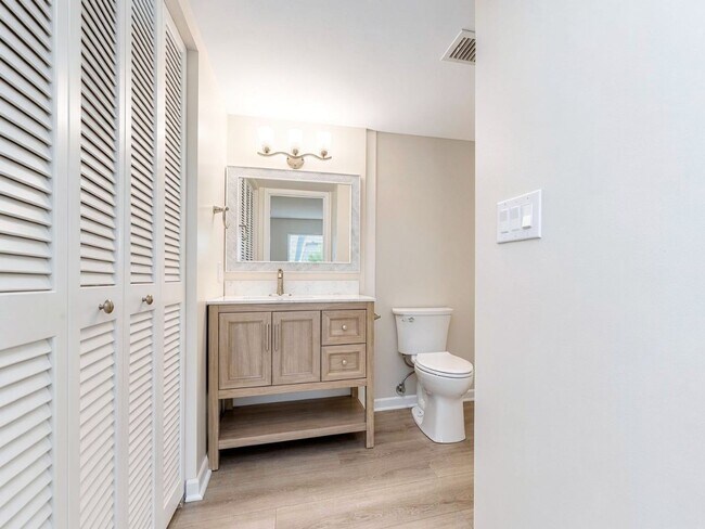 Building Photo - AVAILABLE NOW! Beautifully Renovated First-Floor Condo with Peaceful Screened Lanai