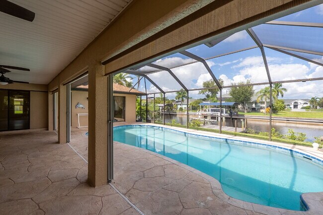 Building Photo - 3 BEDROOM • 2 BATHROOM • PRIVATE POOL • WATERFRONT • BOAT LIFT • ZERO DEPOSIT MOVE-IN AVAILABLE