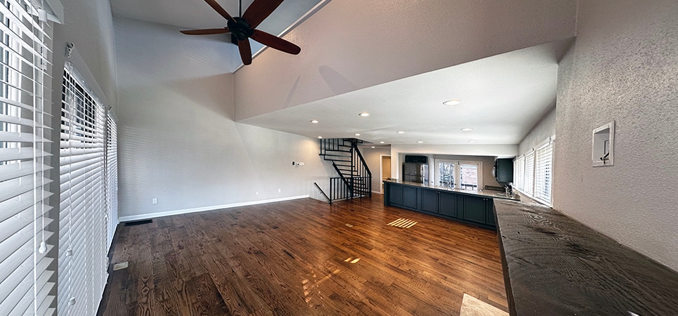The living room opens to the 3rd floor where you can see the loft - 8710 Park Ln
