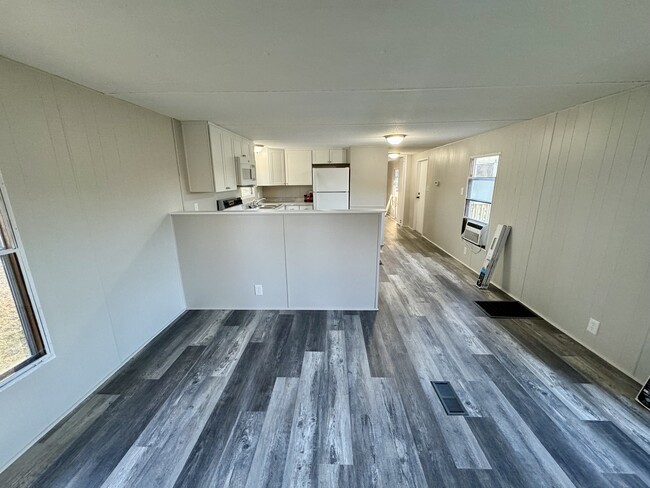 Living room looking into kitchen - 1057 Shiloh Rd N