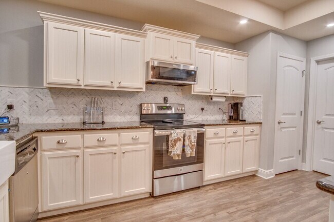 Building Photo - Milton 4BR Pool Home with Office, Vaulted Ceilings, Screened Saltwater Pool & 2-Car Garage