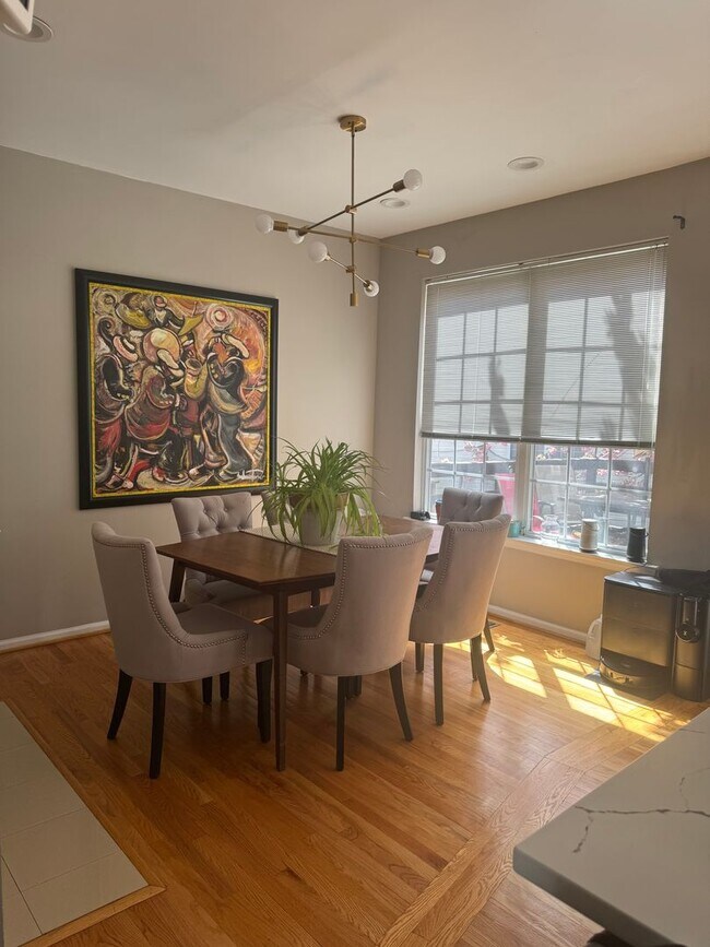 Building Photo - Stunning 3–4 Bedroom Townhome in Private Community | Garage + EV Charger | Deck with Tree Views
