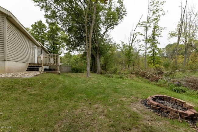 Building Photo - Spacious 3BR Duplex with Finished Basement & 2-Car Garage in Otsego