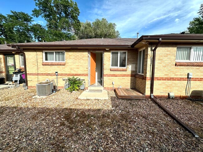 Step into your new home with this welcoming brick exterior that combines style and durability. - Flats at 16th