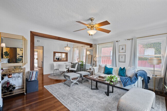 Open concept living and dining room area. - 1150 W 25th St