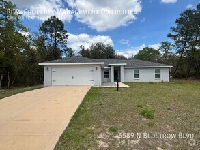 Building Photo - 6589 N Bedstrow Blvd