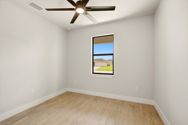 Building Photo - New 3/2 Pool Home for Rent on Canal, Fenced Yard, Pets Welcome. Your Dog Approves of This Backyard