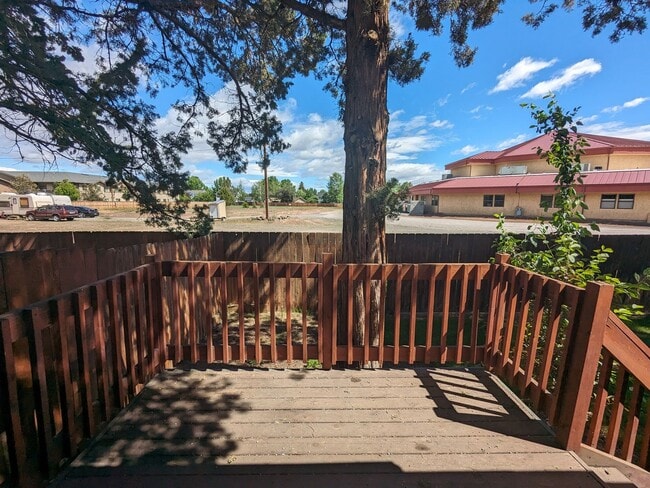 Building Photo - 2x2 duplex with a fenced yard, single-car ...