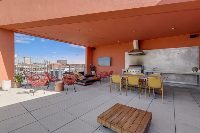 Rooftop Terrace with sitting and dining areas, TV, gas grill and sink with prep station - 600 S Duke St