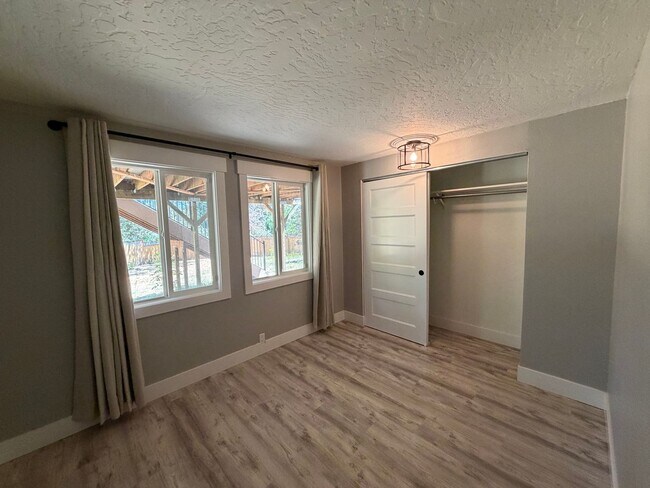Building Photo - Spacious 4BR/3BA Home with Deck, Fenced Yard & Garage