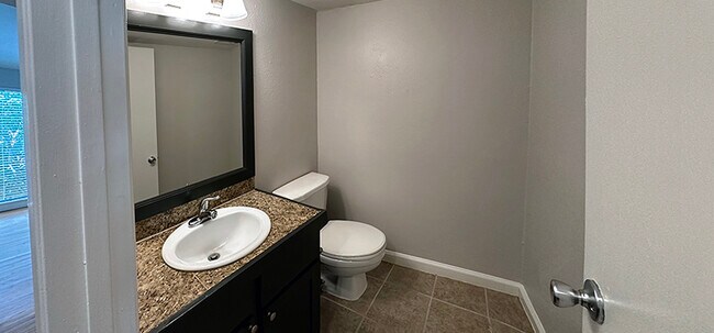 Powder room is located next to the kitchen - 6724 Eastridge Dr