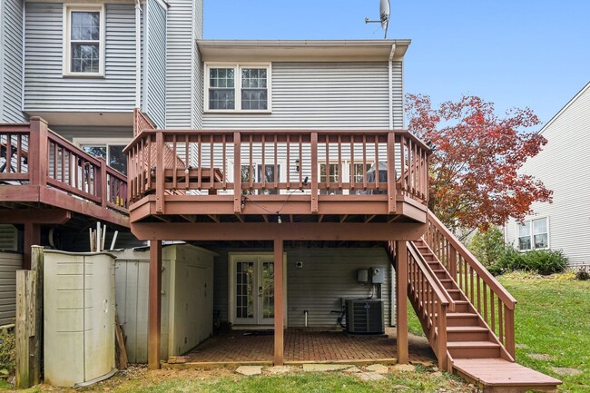 Building Photo - Modern Brick End-Unit Townhome with Stunning Upgrades and Serene Wooded Views