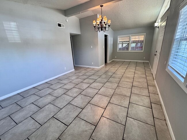 Building Photo - Charming 3-bedroom, 1-bath home featuring an attached carport and a fully fenced backyard—perfect...