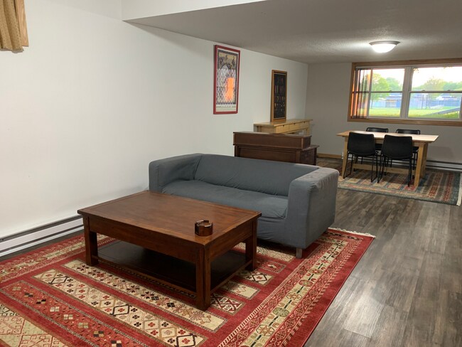 LR and DR with easy clean LVP floors and large area rugs - 317 N Wasson Ln