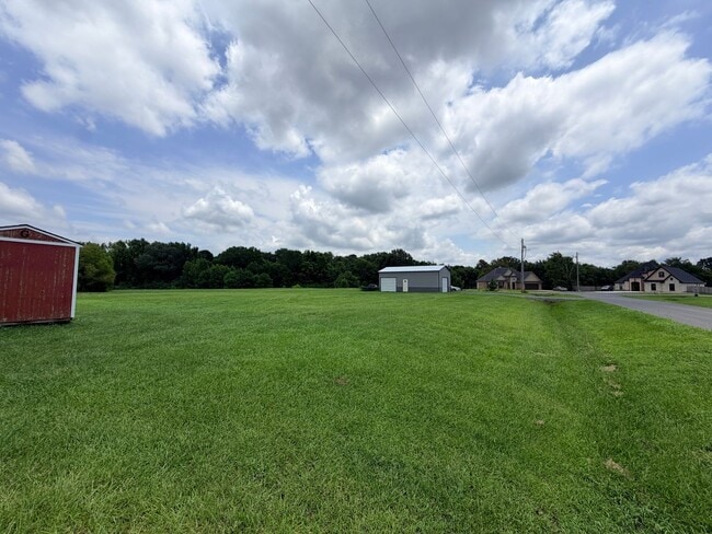 Building Photo - Large lot with Shop for boat or Atvs......