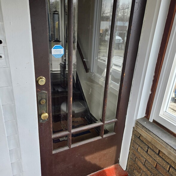 Inside porch unit enstrance to upstairs - 2116 Natchez Ave