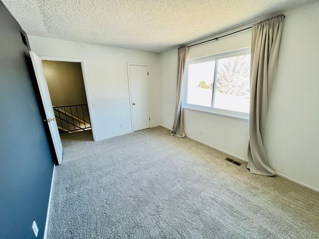 Building Photo - TWO STORY TOWNHOME, NEW FLOORING/CARPET, TWO TONE PAINT, STAINLESS APPLIANCES, WASHER/DRYER, CORN...