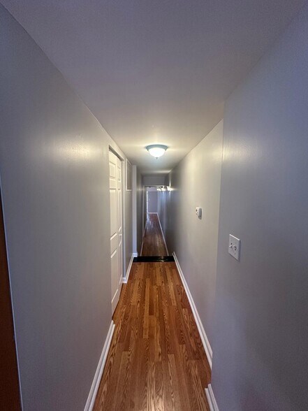 Hallway to the laundry room, 3 bedrooms, and 2 full bathrooms - 1426 Madison Ave