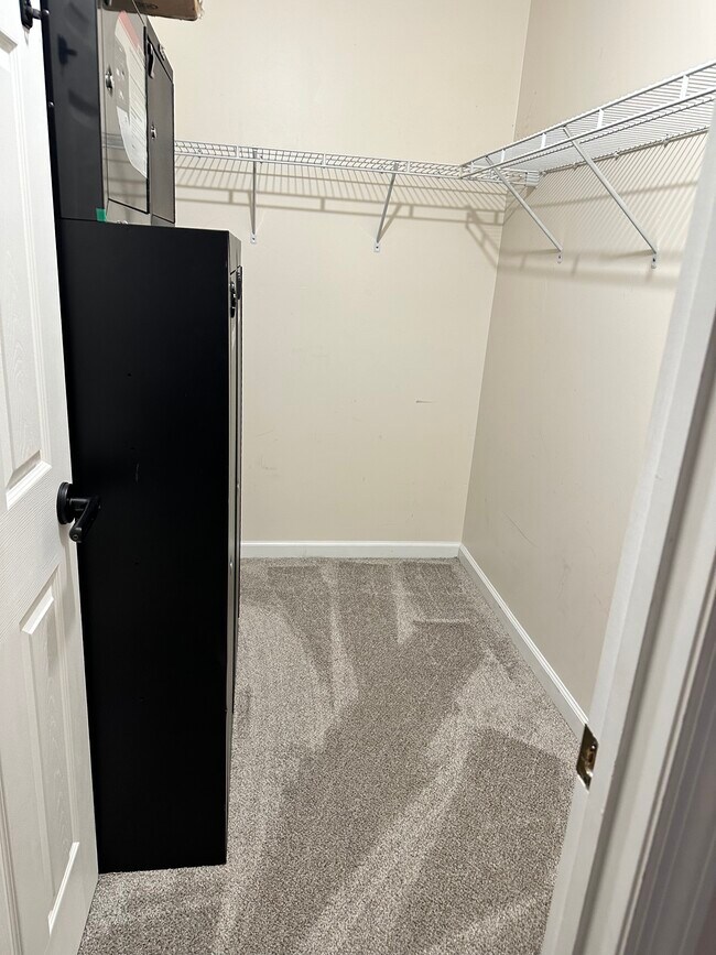 upstairs front bedroom walk-in closet - 178 Kelly Cir