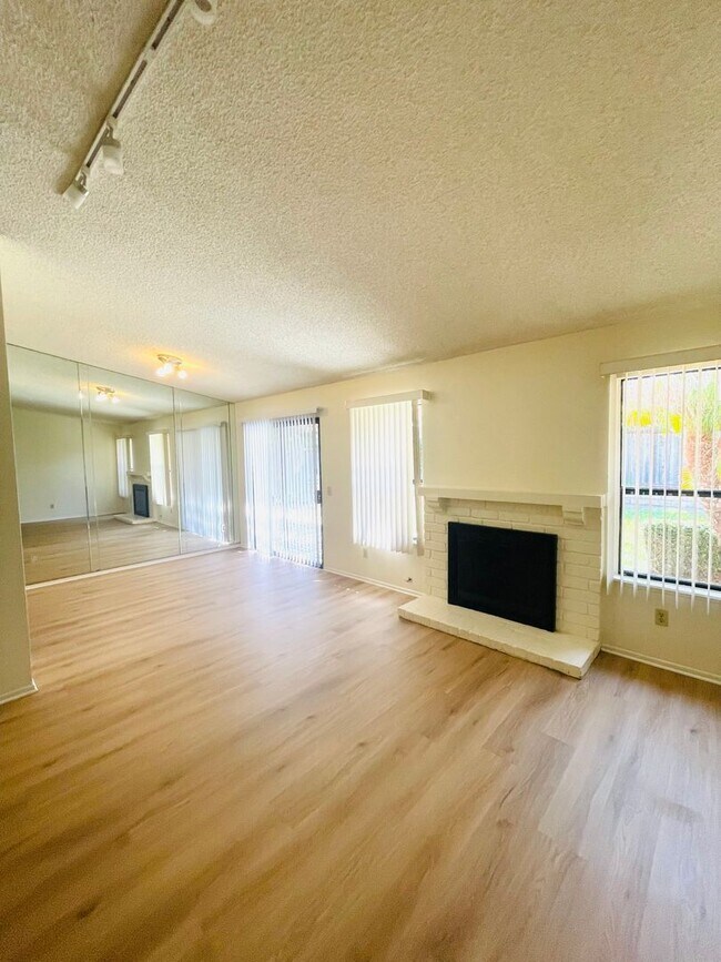 Building Photo - charming 3-bedroom, 2-bathroom home nestle...