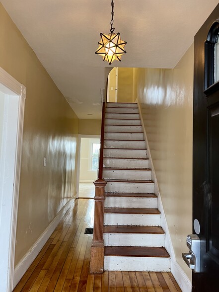 Stairs go to the second floor. Risers will be repainted. - 77 Linden St
